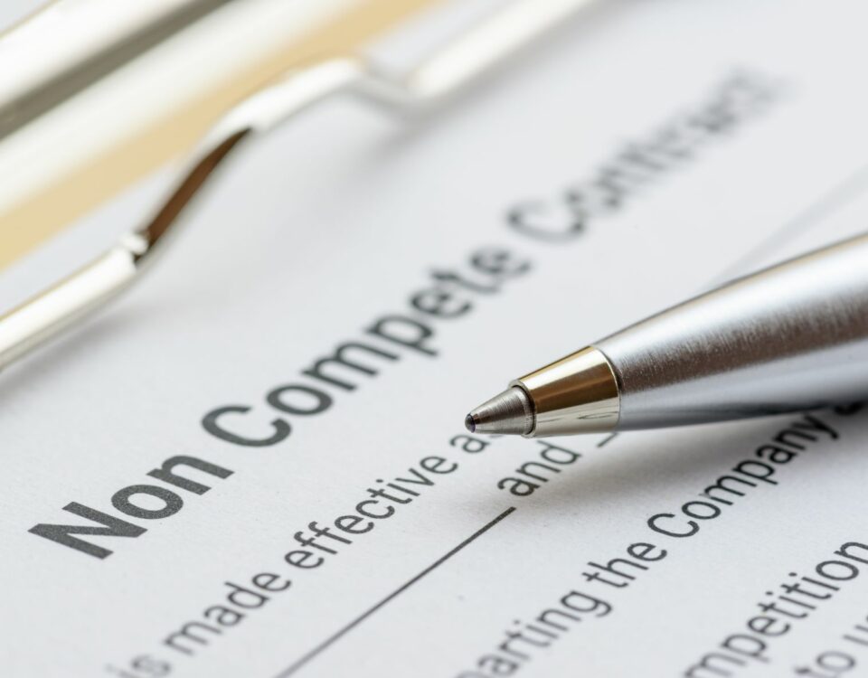 image of non competition contract and pen