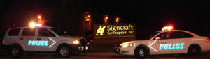 Galena police vehicles with reflective logo wraps in front of Signcraft building