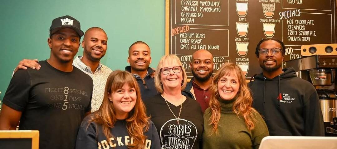 Eight Fifteen Capital partners pose with former owners of Wired Cafe.