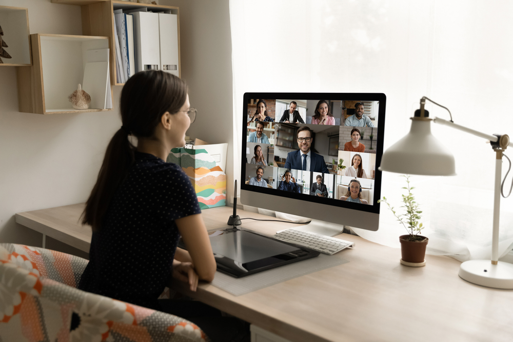 Woman on a virtual team call from her home office.